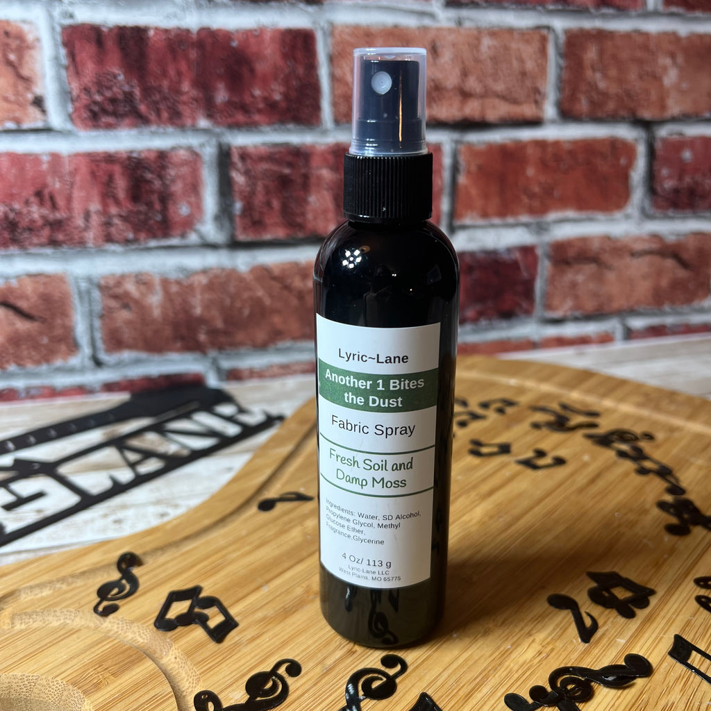 Lyric-Lane fabric spray featuring Another 1 Bites the Dust - Smells Like Dirt. On Purpose. with fresh soil and damp moss scent