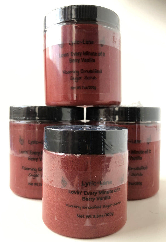 Four jars of crimson Lovin' Every Minute of It-Berry Vanilla scented whipped emulsified sugar scrub. Three 7 oz PET plastic jars stacked in a pyramid and one 3.5 oz jar in the front on a white background. Made by Lyric-Lane.